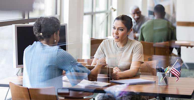 women-obtaining-mortgage-at-bank