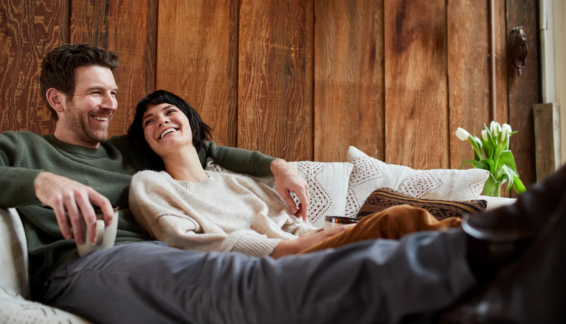 A photo of a man and a woman on a couch
